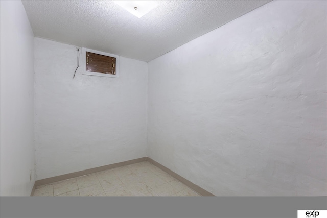 empty room featuring a textured ceiling