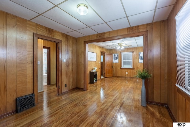 interior space featuring hardwood / wood-style flooring and wood walls