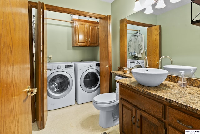 laundry room featuring washer and clothes dryer and sink