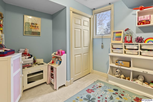 recreation room with light carpet