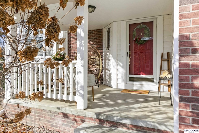 entrance to property featuring a porch