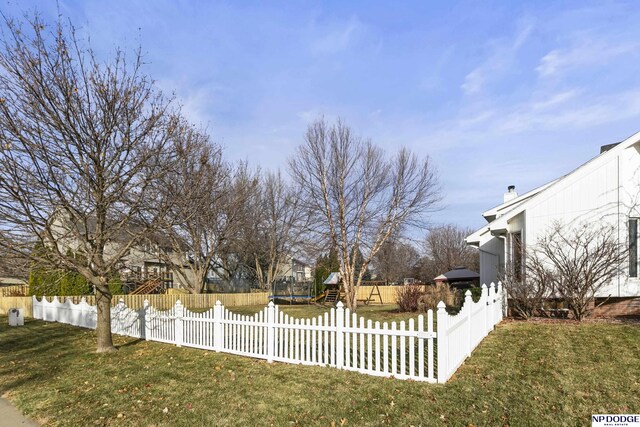 view of yard with a trampoline