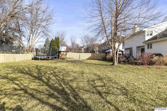 view of yard with a trampoline