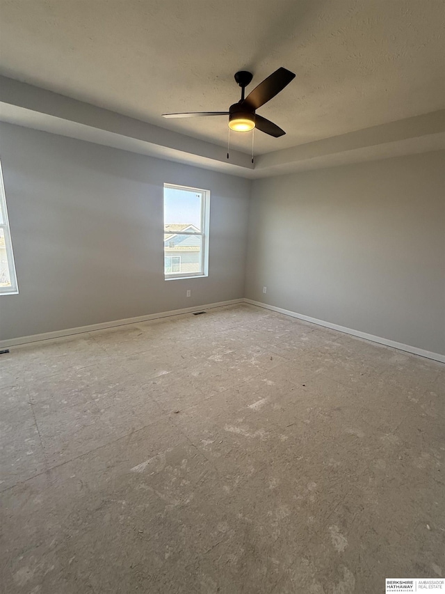 2175 N Aaron Way, Fremont, NE 68025 - empty room featuring a ceiling fan, baseboards, and a textured ceiling