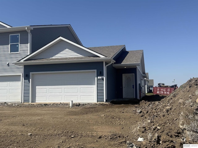 view of front of property featuring an attached garage and driveway