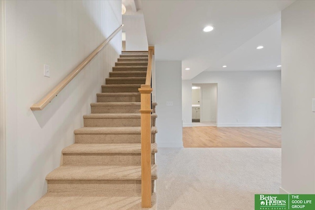 stairs with baseboards, carpet flooring, and recessed lighting