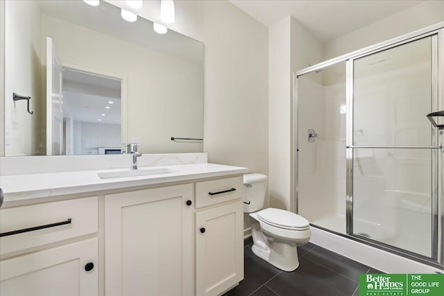 full bathroom with a stall shower, tile patterned flooring, vanity, and toilet