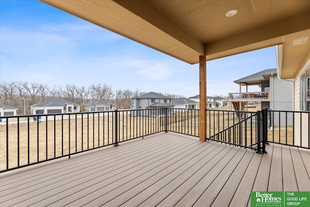 wooden deck featuring a residential view