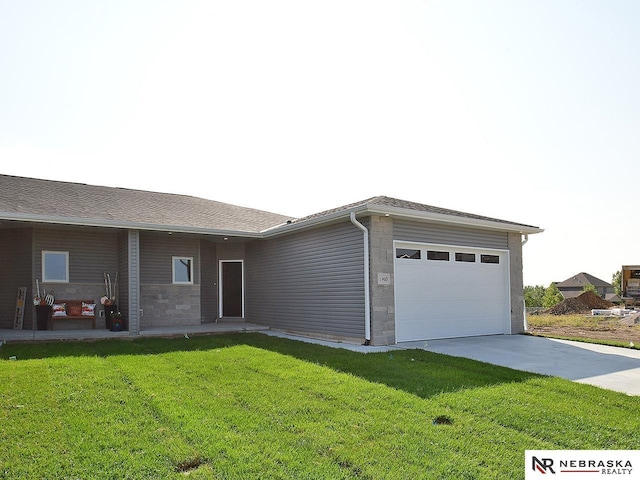 single story home with a front lawn and a garage