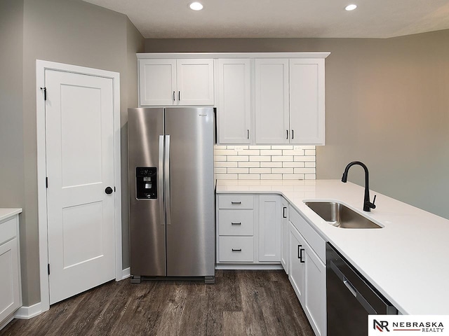 kitchen with white cabinetry, dishwasher, stainless steel refrigerator with ice dispenser, and sink