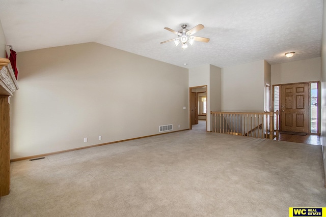 unfurnished living room featuring carpet flooring, ceiling fan, and lofted ceiling