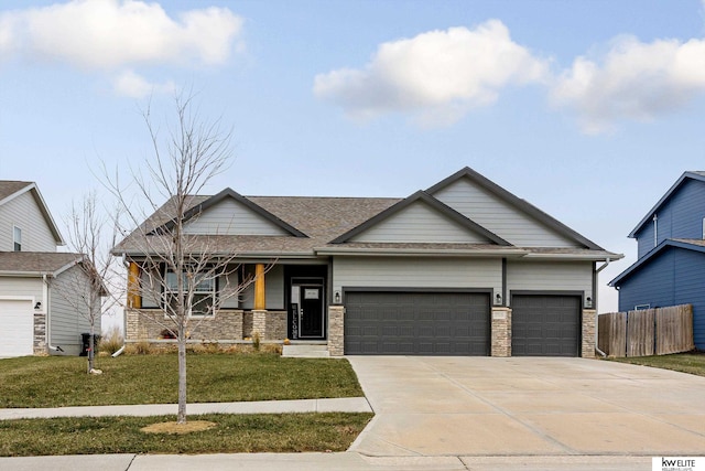 view of front of house with a garage and a front lawn