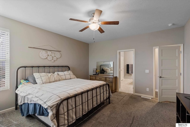 bedroom featuring ceiling fan and dark carpet