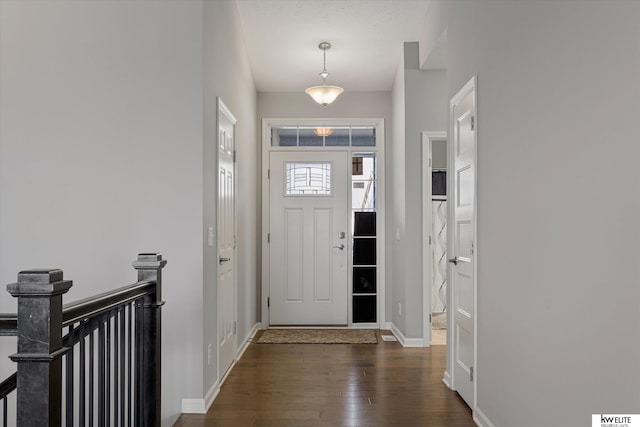 foyer with dark hardwood / wood-style flooring