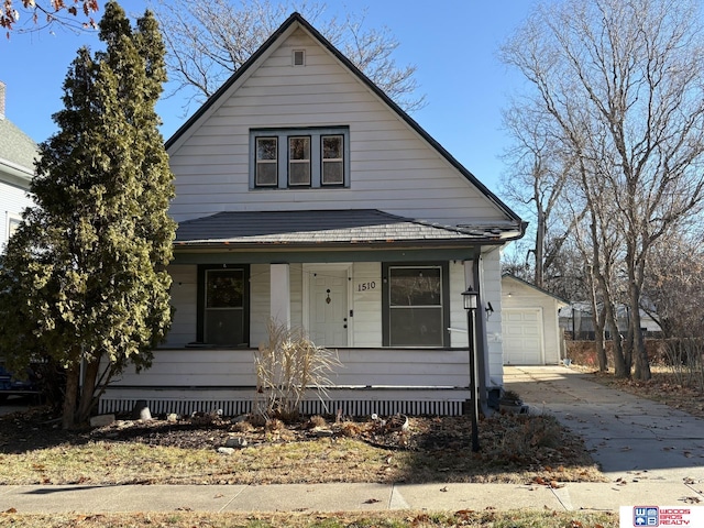 bungalow-style home featuring a porch and a garage