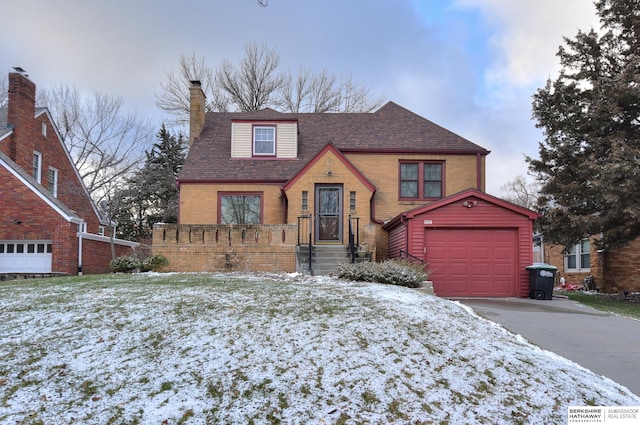 view of front of house with an outdoor structure and a garage