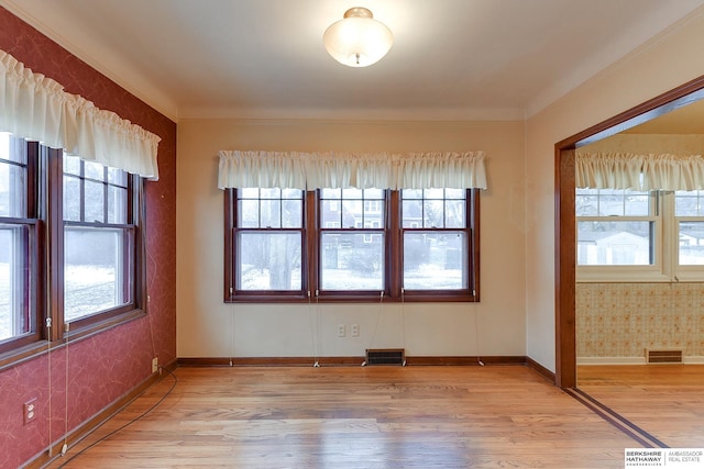 unfurnished room featuring light hardwood / wood-style floors