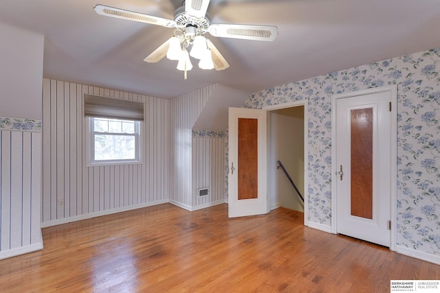 spare room featuring ceiling fan and light hardwood / wood-style flooring