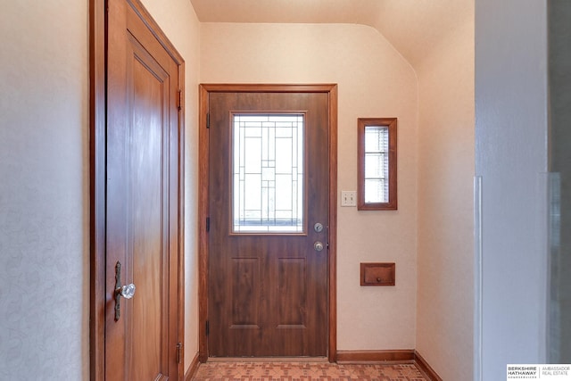 foyer entrance with lofted ceiling