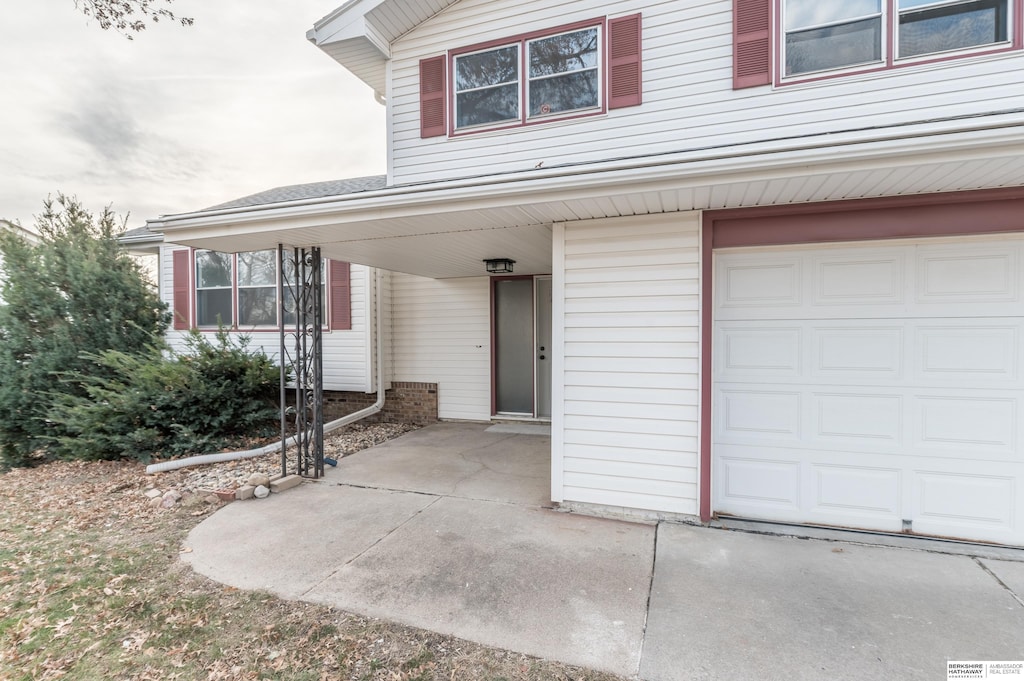 doorway to property featuring a garage