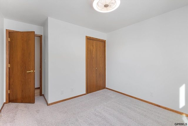 unfurnished bedroom featuring light colored carpet