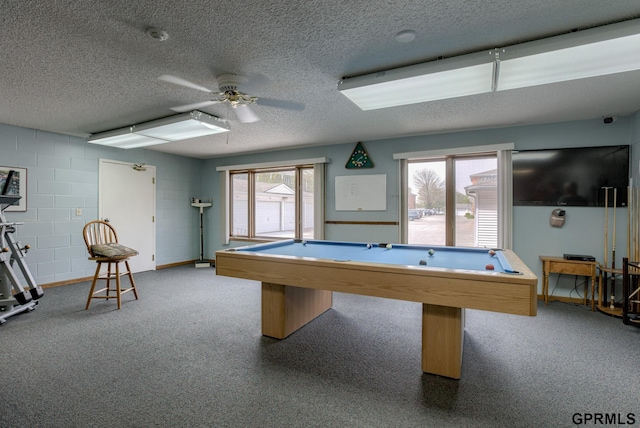 game room featuring ceiling fan, a textured ceiling, and pool table