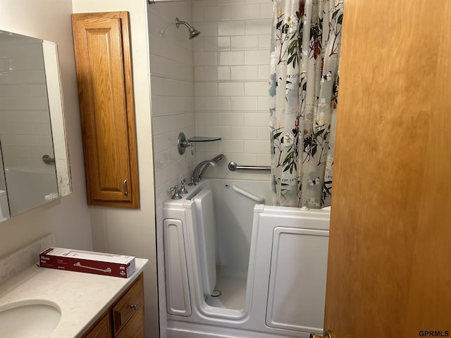 bathroom featuring vanity and shower / bath combo