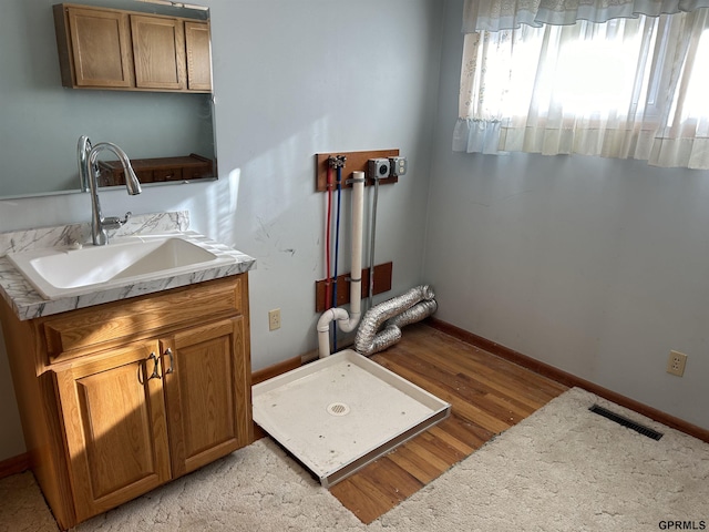 bathroom featuring hardwood / wood-style floors and vanity