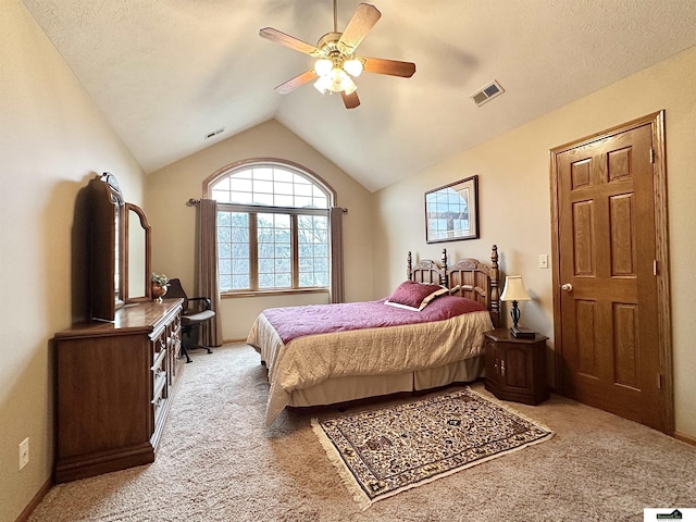 carpeted bedroom featuring ceiling fan and lofted ceiling