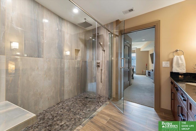 bathroom with vanity and an enclosed shower