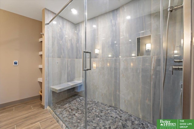 bathroom featuring an enclosed shower and toilet