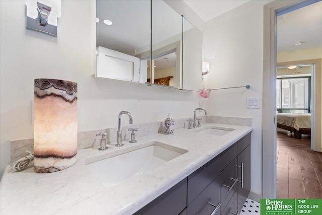 bathroom with hardwood / wood-style floors and vanity