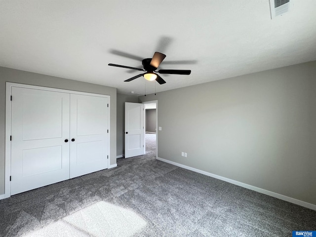 unfurnished bedroom with carpet flooring, ceiling fan, and a closet