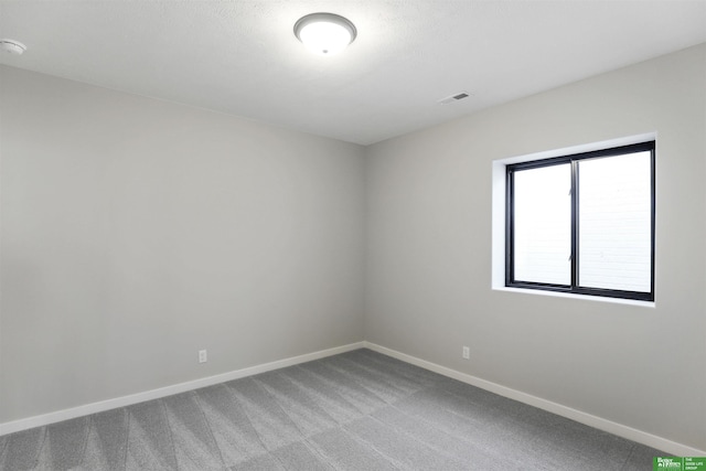 spare room with carpet flooring