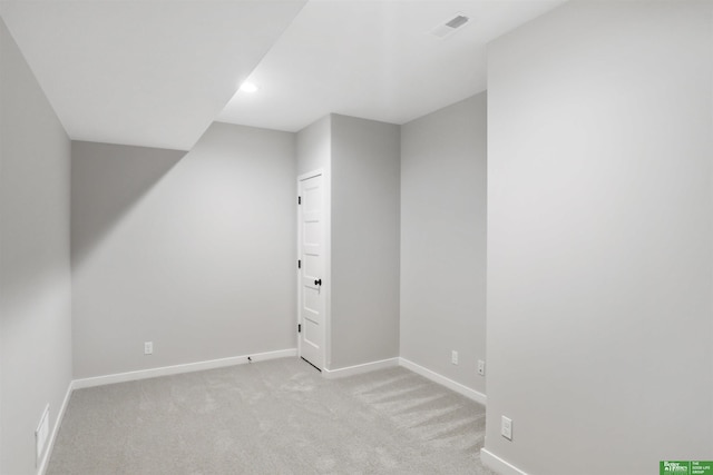 bonus room with light colored carpet