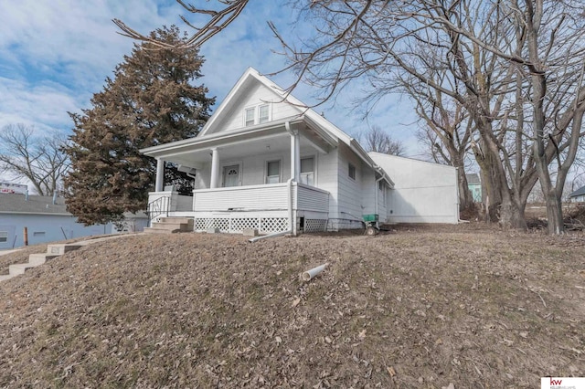 view of front of property featuring covered porch