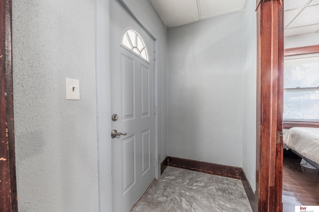 doorway featuring a paneled ceiling