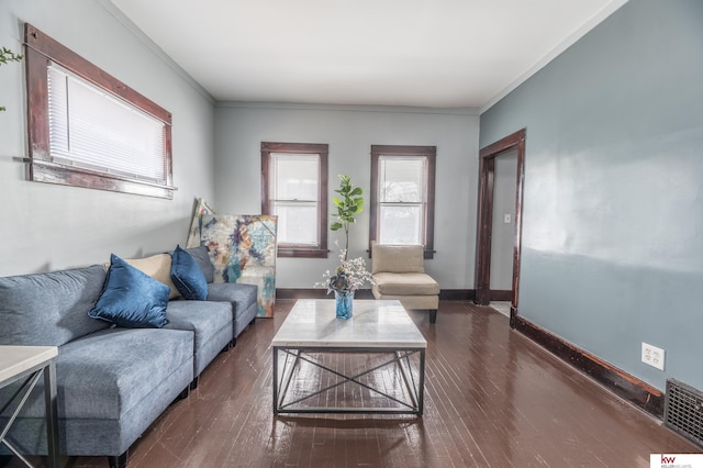 living room with dark hardwood / wood-style flooring and ornamental molding