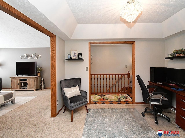 office with carpet flooring, a raised ceiling, a chandelier, and a textured ceiling