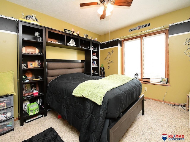 bedroom featuring light carpet and ceiling fan