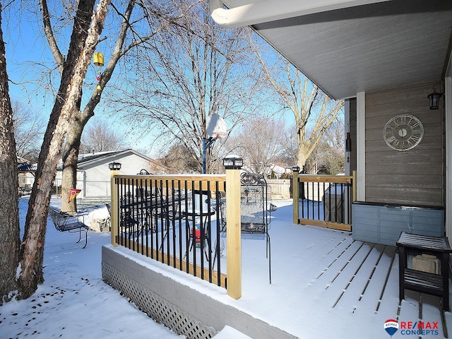 view of snow covered deck