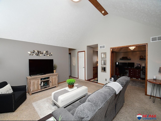 living room with beamed ceiling, a textured ceiling, light colored carpet, and high vaulted ceiling