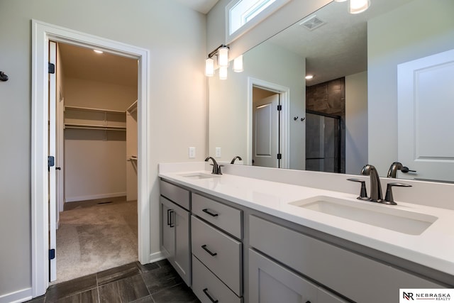 bathroom with vanity and walk in shower