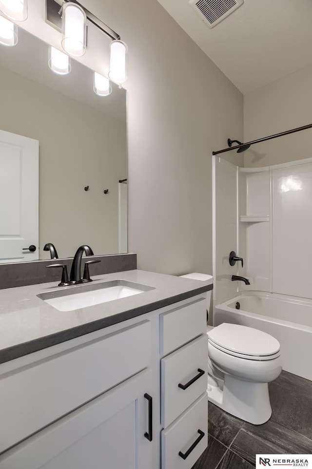 full bathroom featuring vanity, toilet, and shower / washtub combination