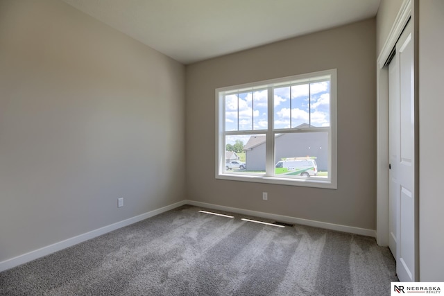 unfurnished room with carpet