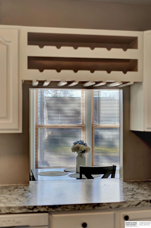 kitchen with white cabinets and dishwashing machine