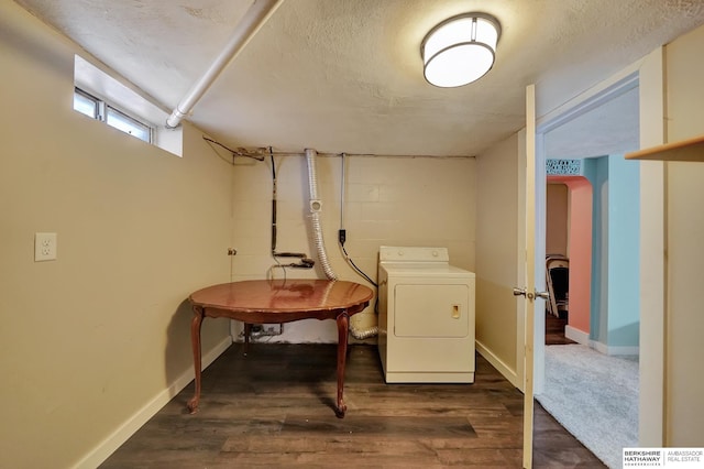 basement with washer / dryer and dark hardwood / wood-style floors