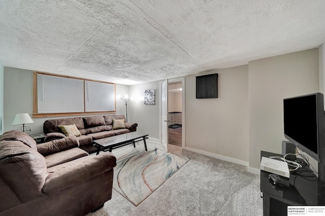 carpeted living room with a textured ceiling