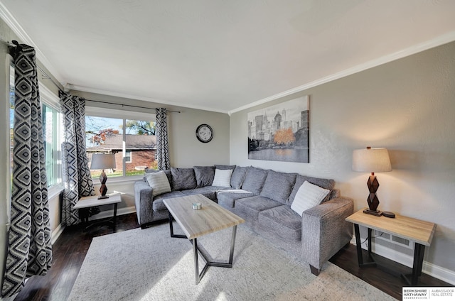 living room with dark hardwood / wood-style flooring and crown molding