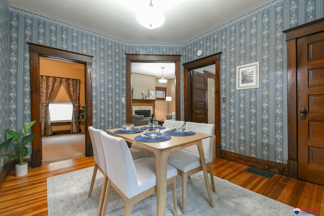 dining area with hardwood / wood-style flooring